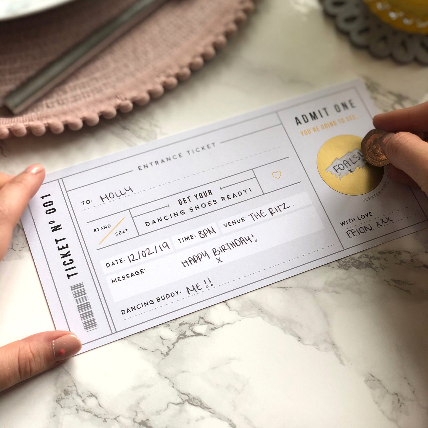 Scratching off the surprise on Rodo Creative Grey Scratch Card Concert Gig Ticket